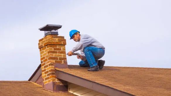 Chimney Repair Contractors Fixing a Chimney